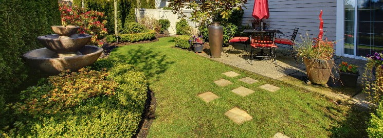 Backyard garden with fountain and step stones